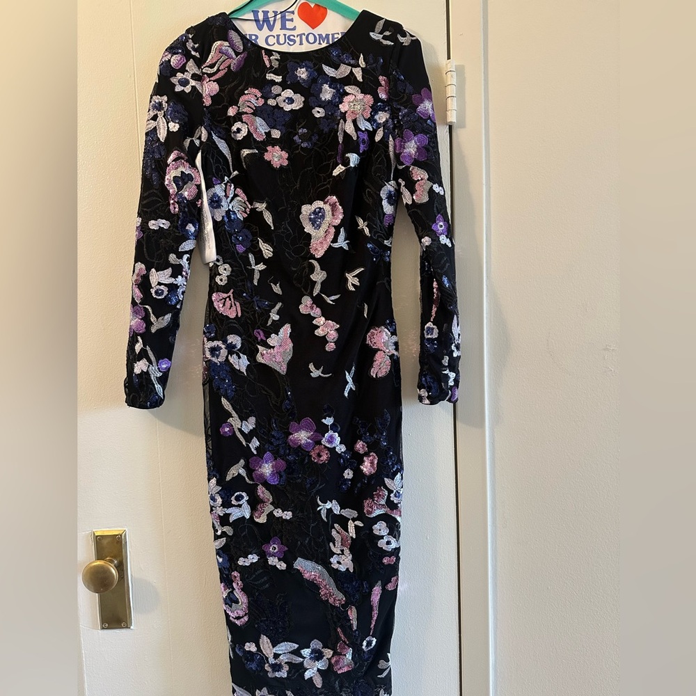 Lovely sequined party dress, never worn. Professionally dry cleaned.